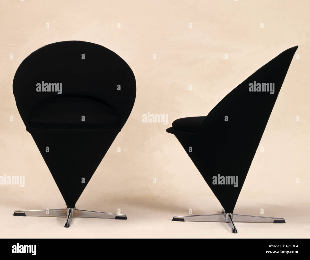 Two black coneshaped chairs on steel feet Stock Photo Alamy