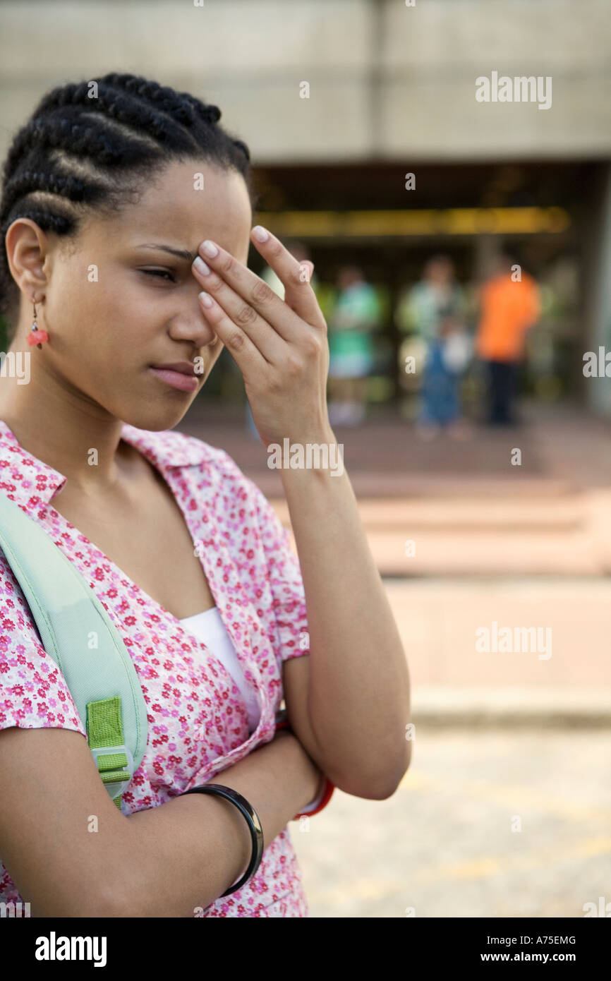 Woman rubbing her forehead Stock Photo Alamy
