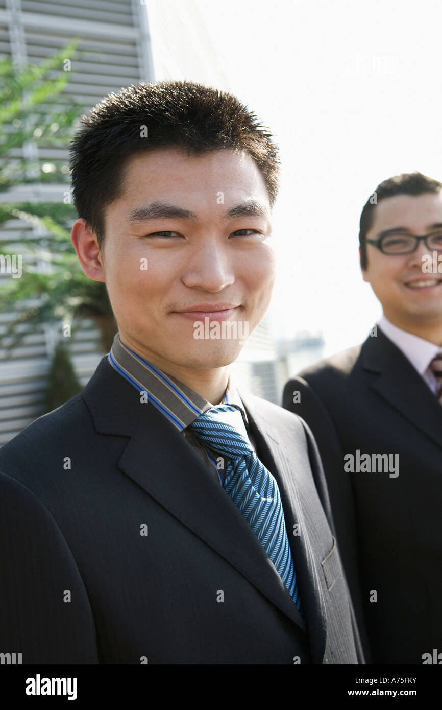 Businessman smiling outdoors Stock Photo - Alamy
