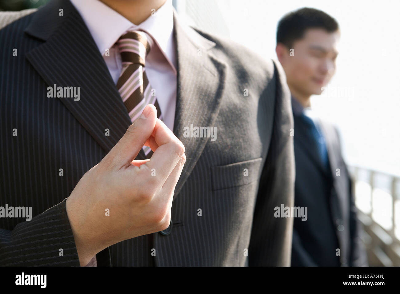 Businessman snapping his fingers Stock Photo Alamy