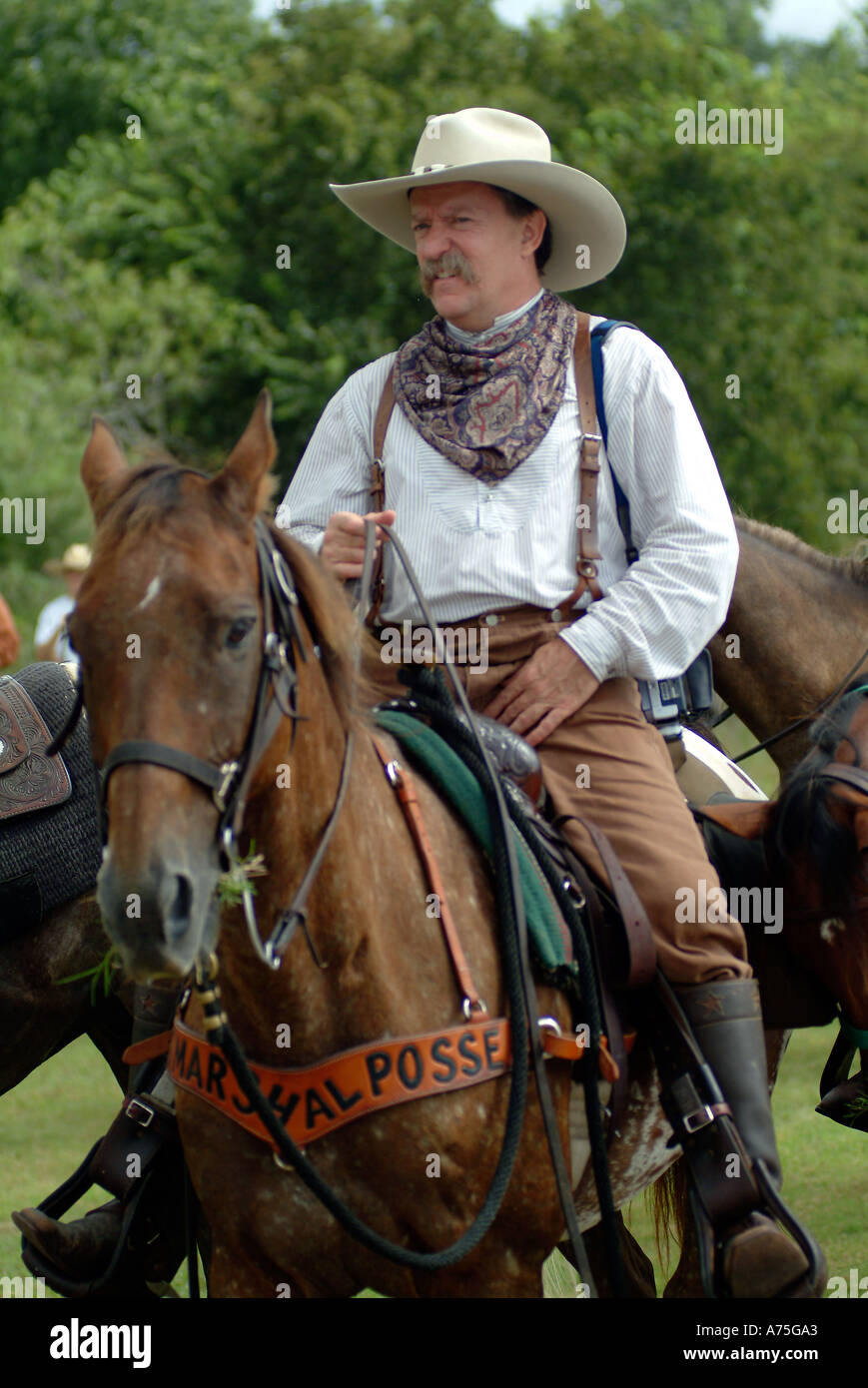 A cowboy riding a horse in Bandera Texas Stock Photo Alamy