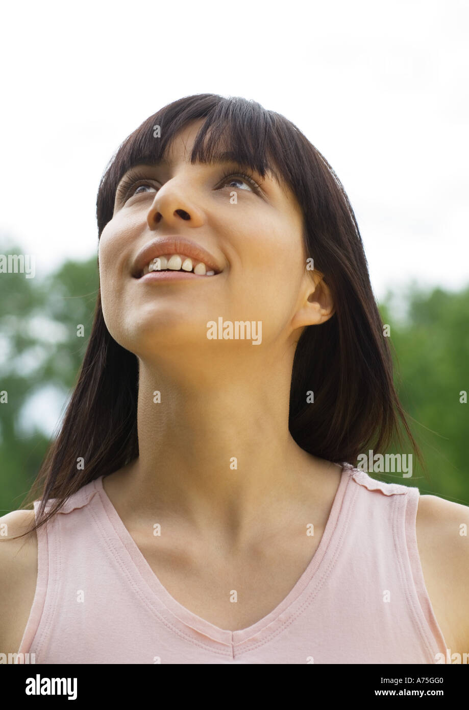 Young woman looking up, portrait Stock Photo