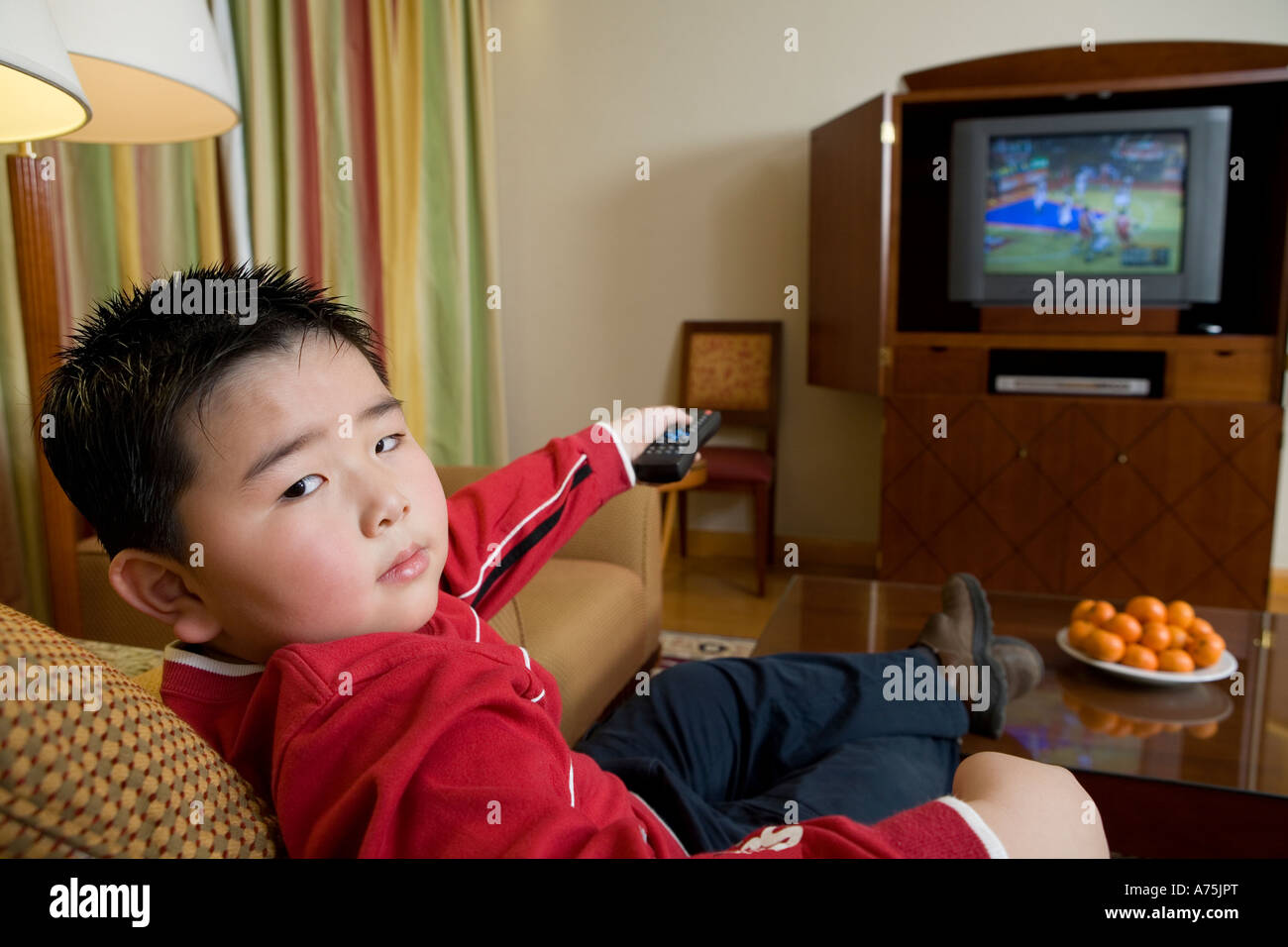 Young boy watching television Stock Photo Alamy