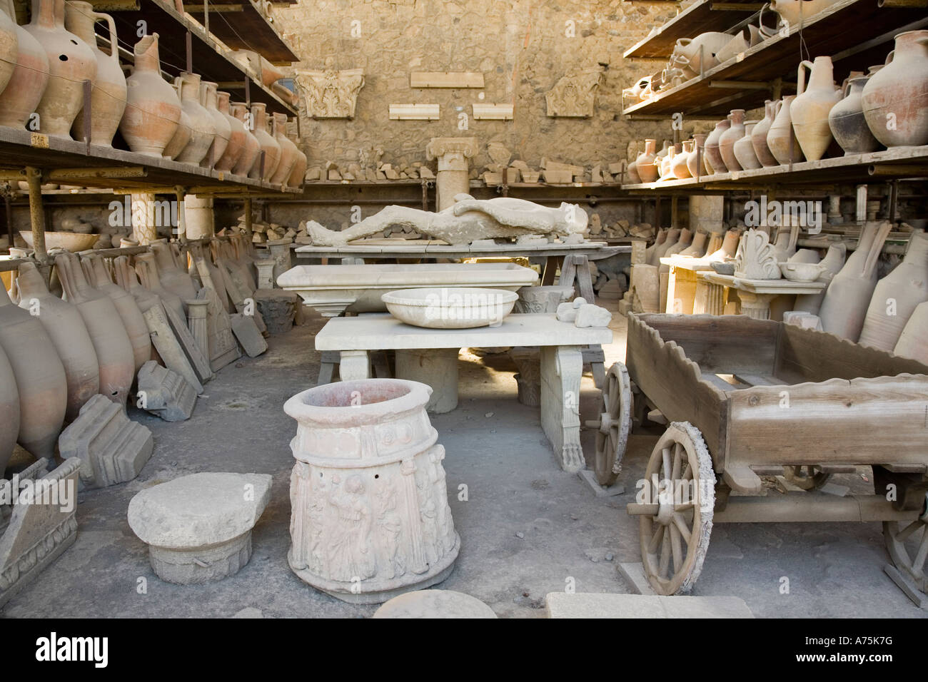 Pompeii, Campania, Italy; artifacts recovered during excavation including a cast of a human body. Stock Photo