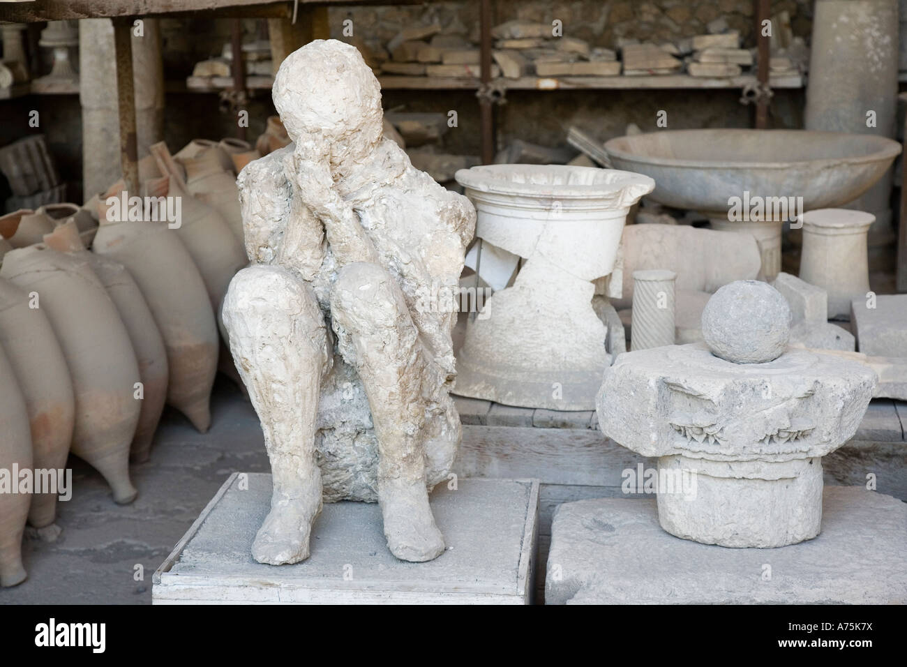 Pompeii, Campania, Italy; artifacts recovered during excavation including a cast of a human body. Stock Photo