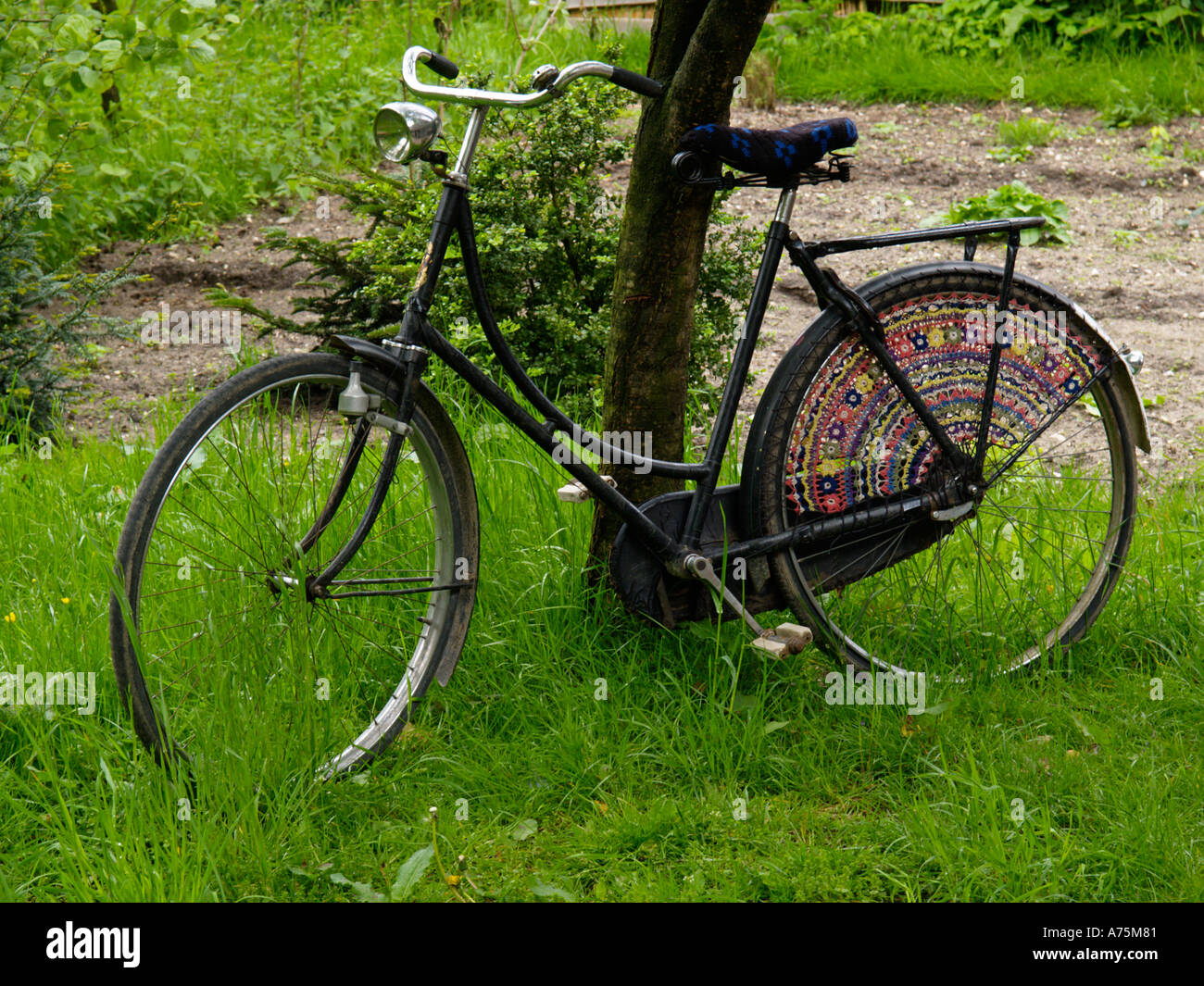 Dutch so called grandma s bicycle or omafiets with original crocheted coat  protectors and seat cover the Netherlands Stock Photo - Alamy