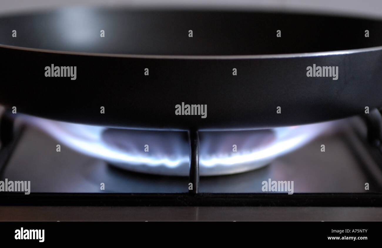 Large frying pan on gas hob Stock Photo Alamy