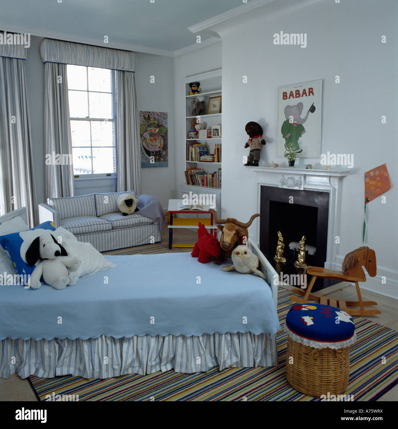 Child S Bedroom With Blue Cover On Bed And Wooden Rockinghorse In