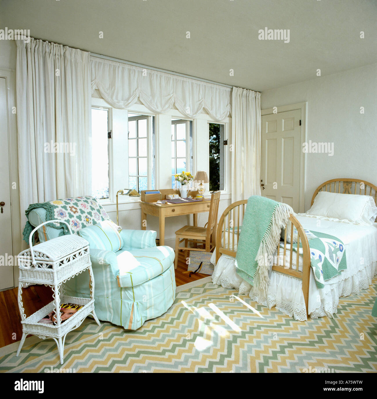 Seaside Bedroom With Turquoise Loosecover On Armchair And
