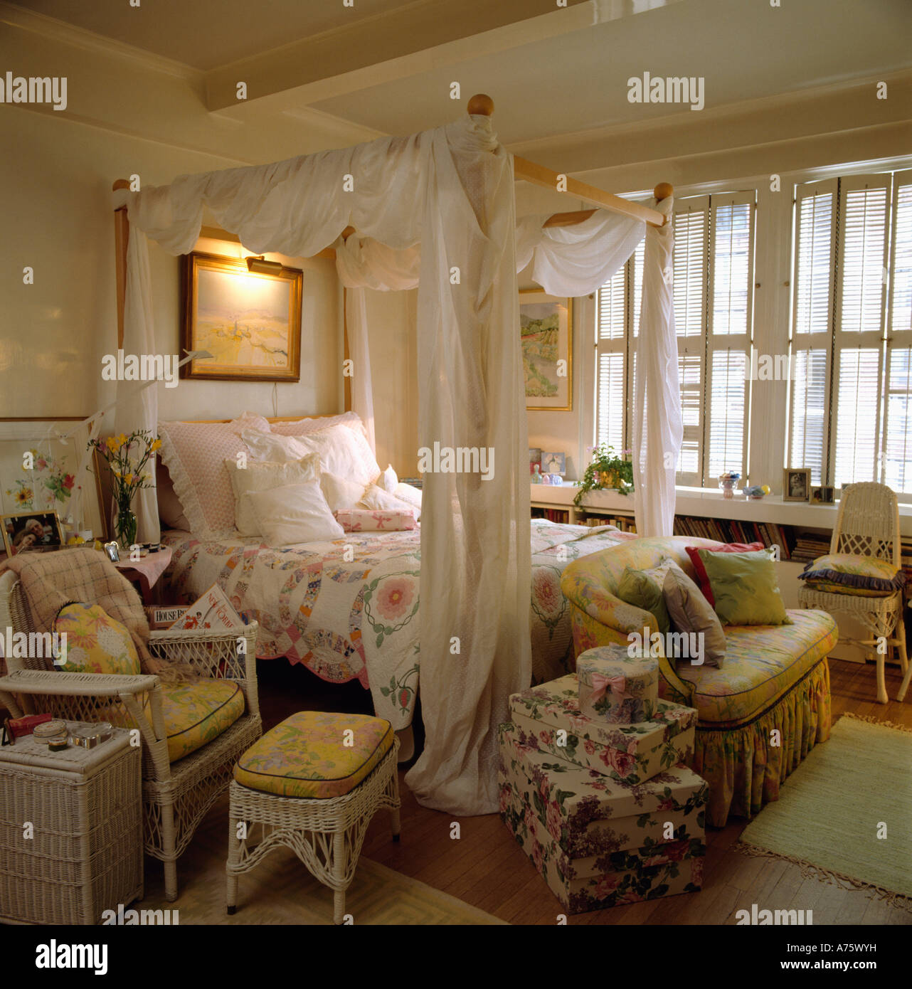 Four Poster Bed With White Muslin Drapes In Traditional