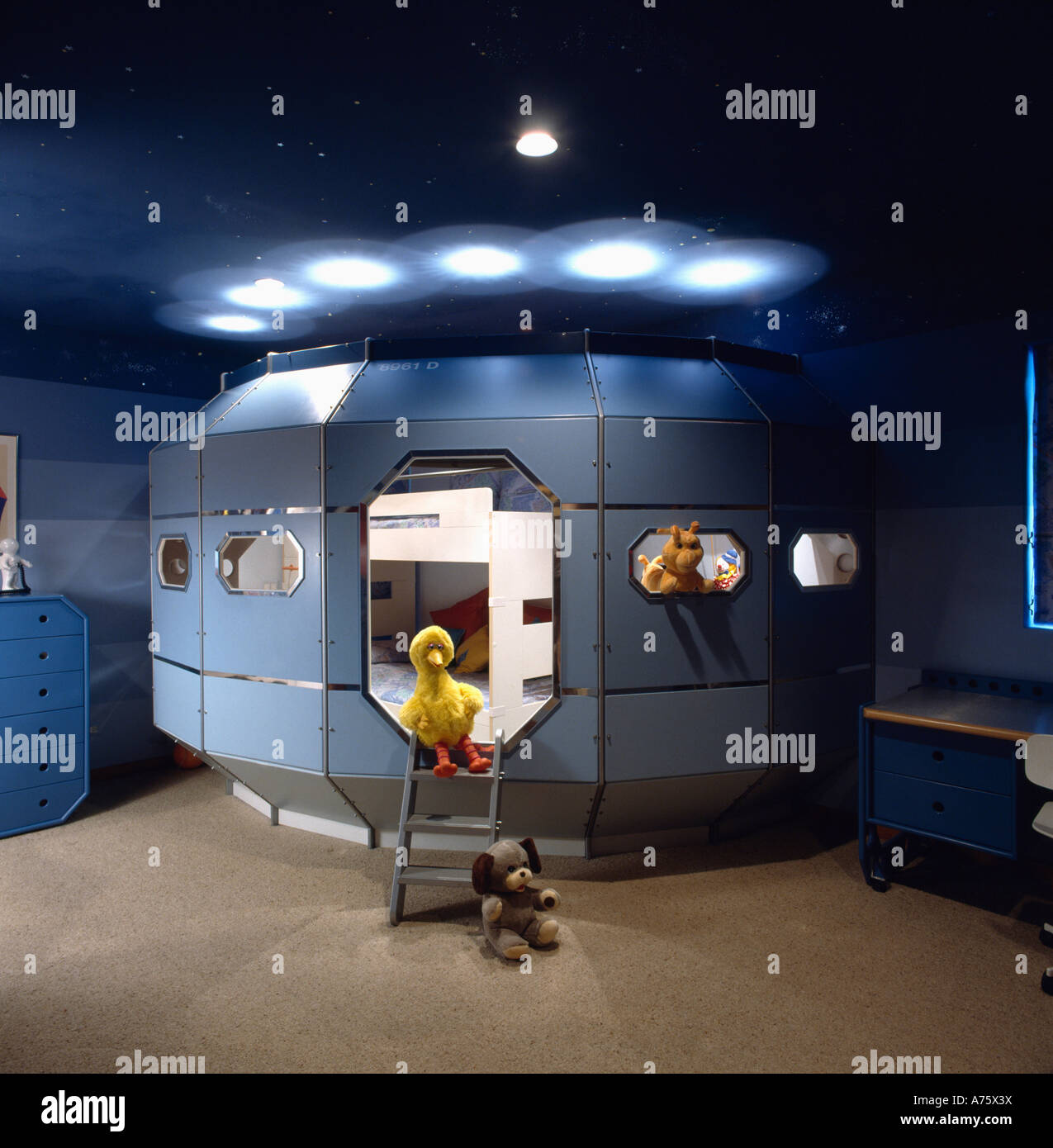 Eighties children's bedroom with space capsule bed and toy duck Stock Photo
