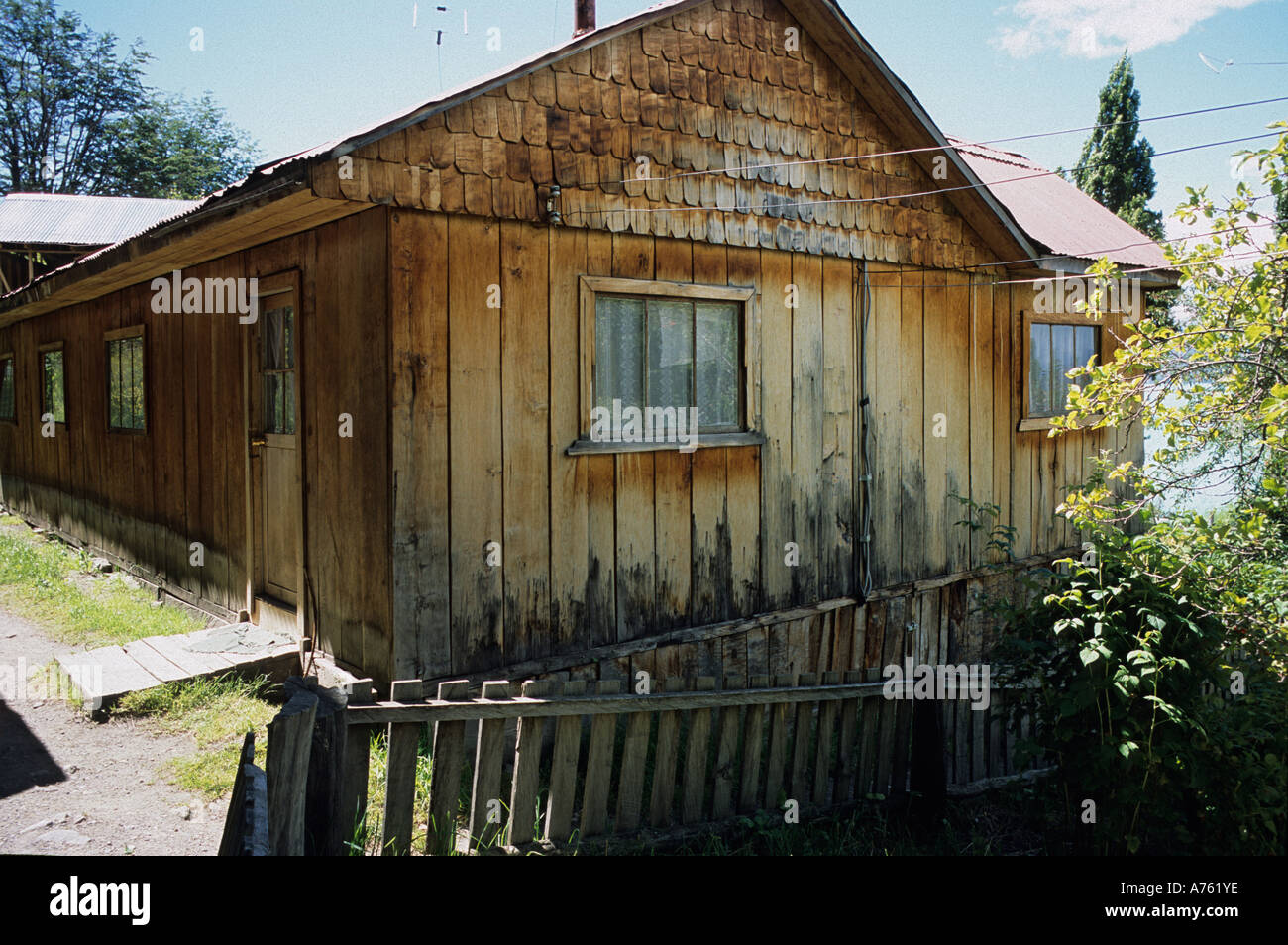 traditional wooden house in Patagonia Chile with wooden roof tiles and slatted cladding Candelario Mancilla Stock Photo