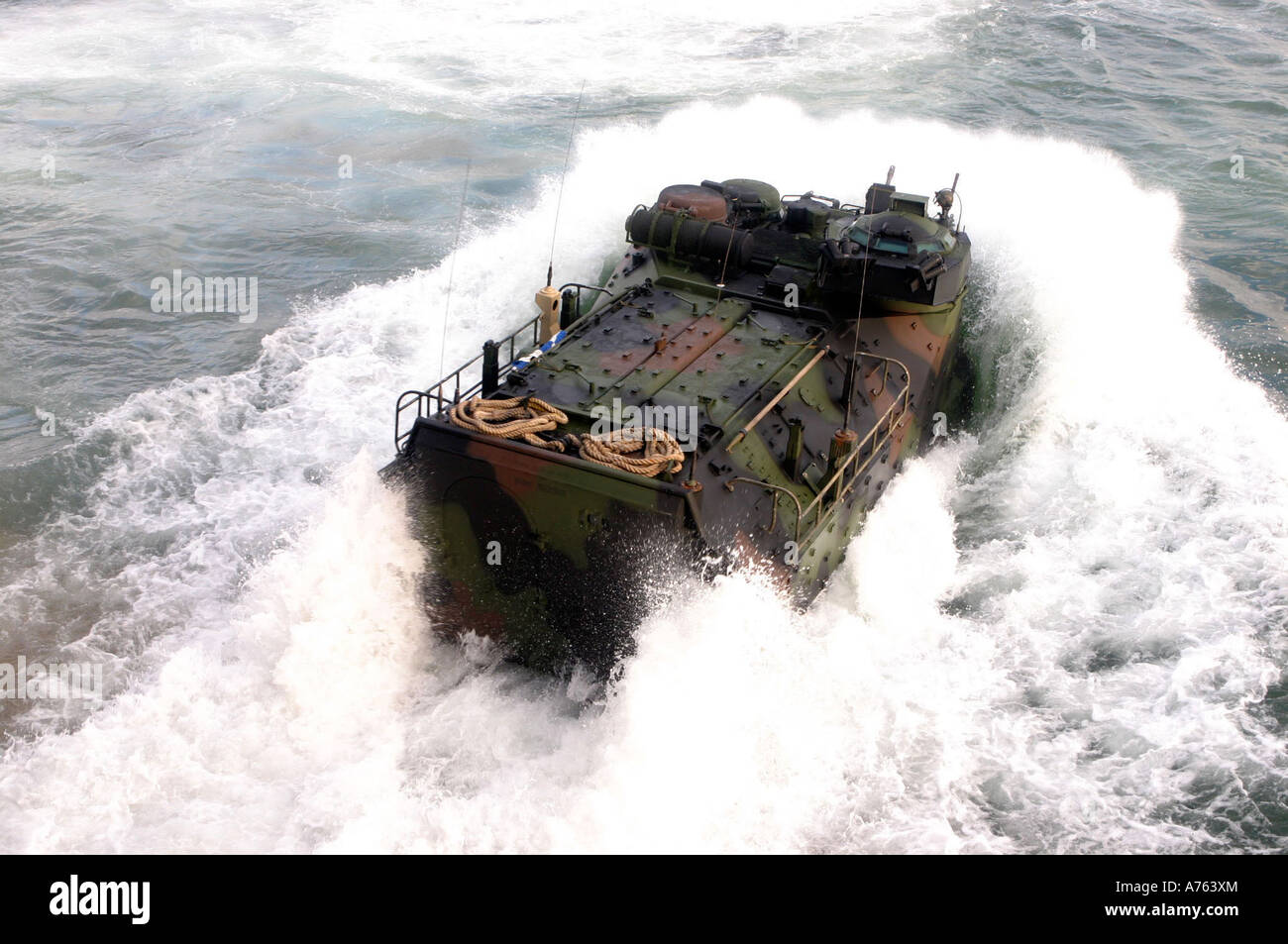 An amphibious assault vehicle splashes off the USS Whidbey Island off the coast of North Carolina during ship operation training Stock Photo