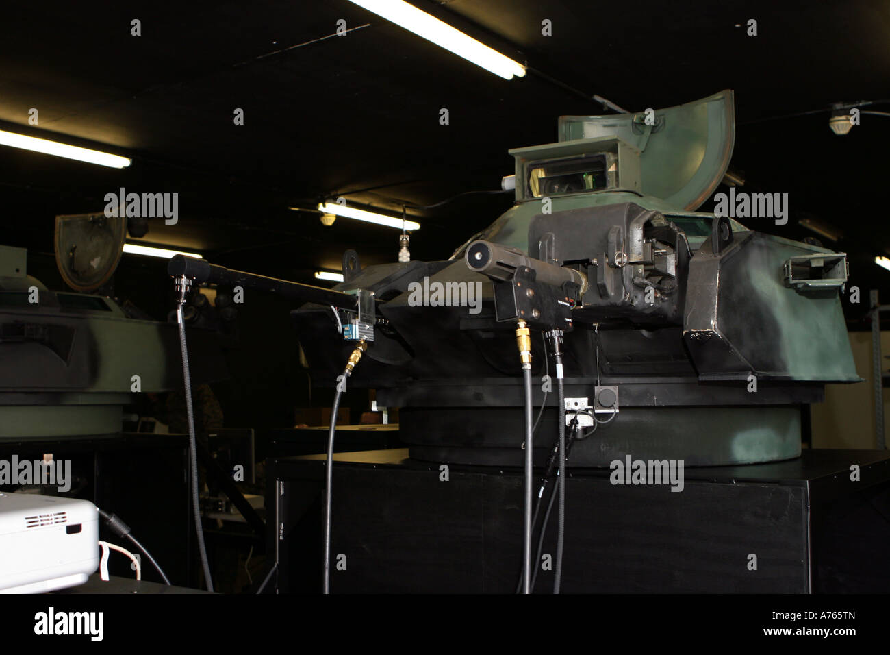 A newly installed amphibious assault vehicle turret trainer sits in an old armory building. Stock Photo