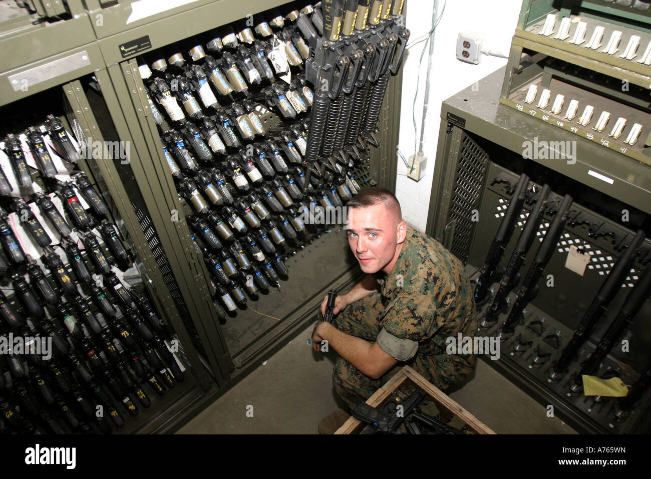 Small arms repair technician conducts a sight count of the weapons in