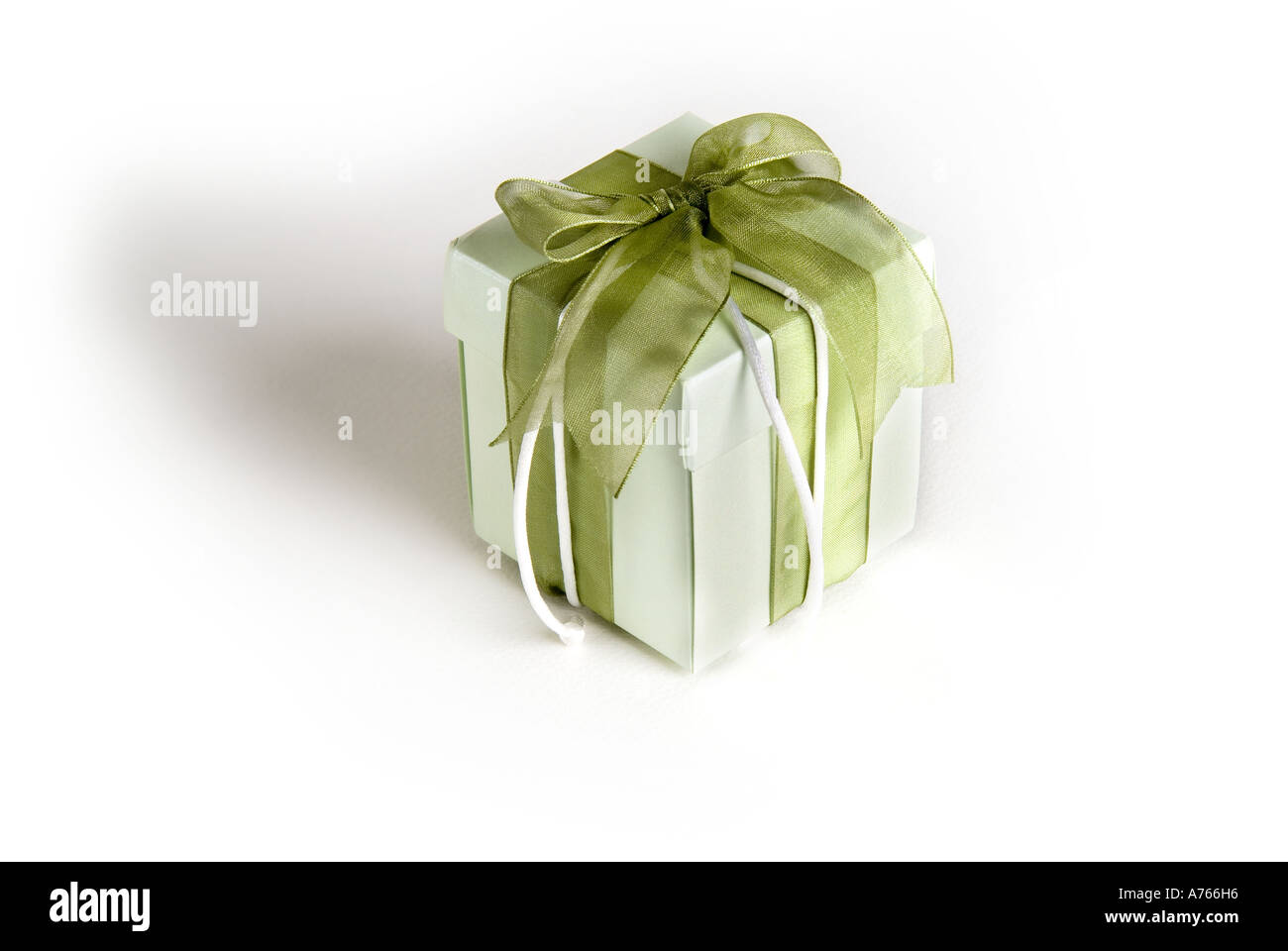 Light green box with green ribbon and white string Stock Photo Alamy