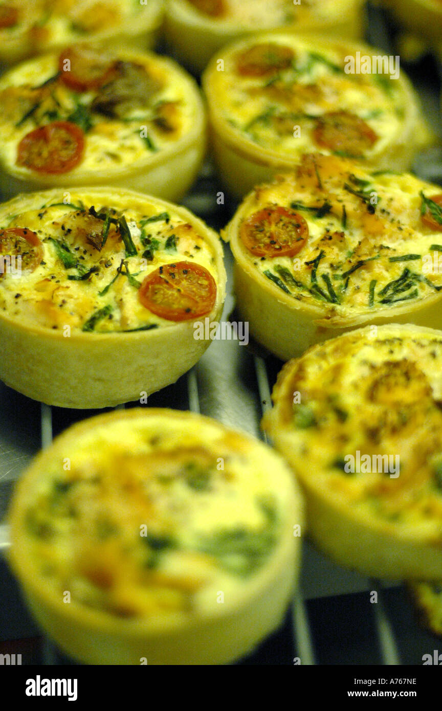 Quiches on baking tray Stock Photo Alamy