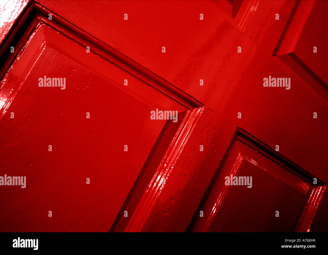 Red panelled wooden door Stock Photo