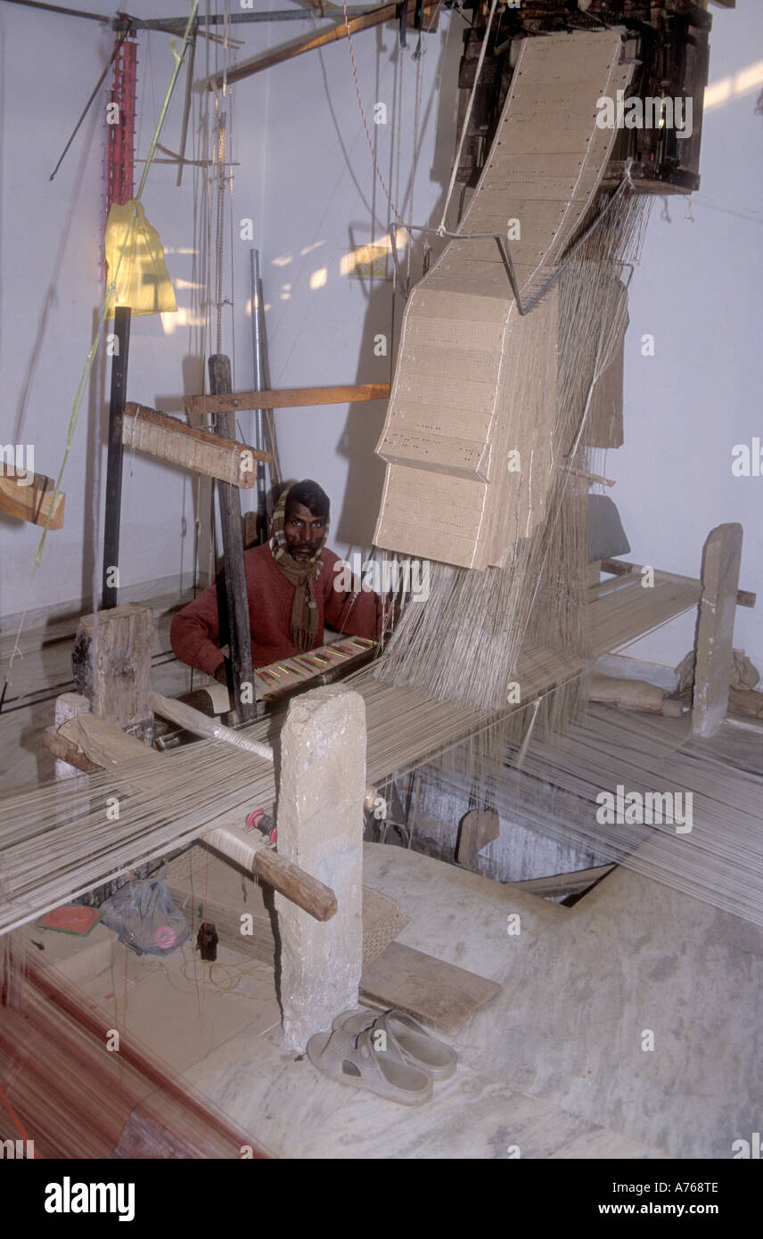 Silk weaver at a small factory in Varanasi India Stock Photo