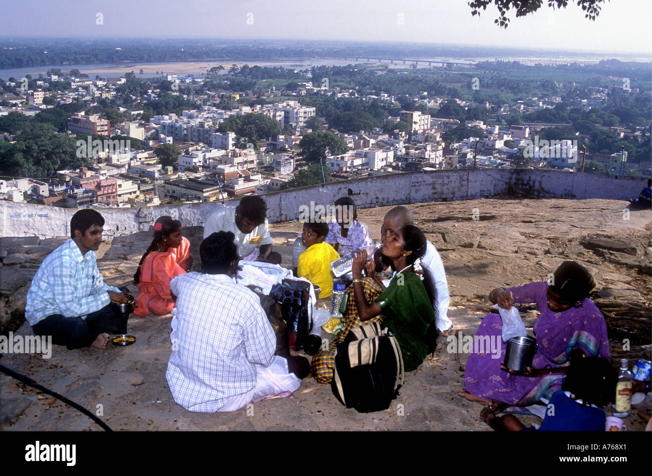 An Indian family having a picnic and enjoying the view from the summit of the Rock Fort over