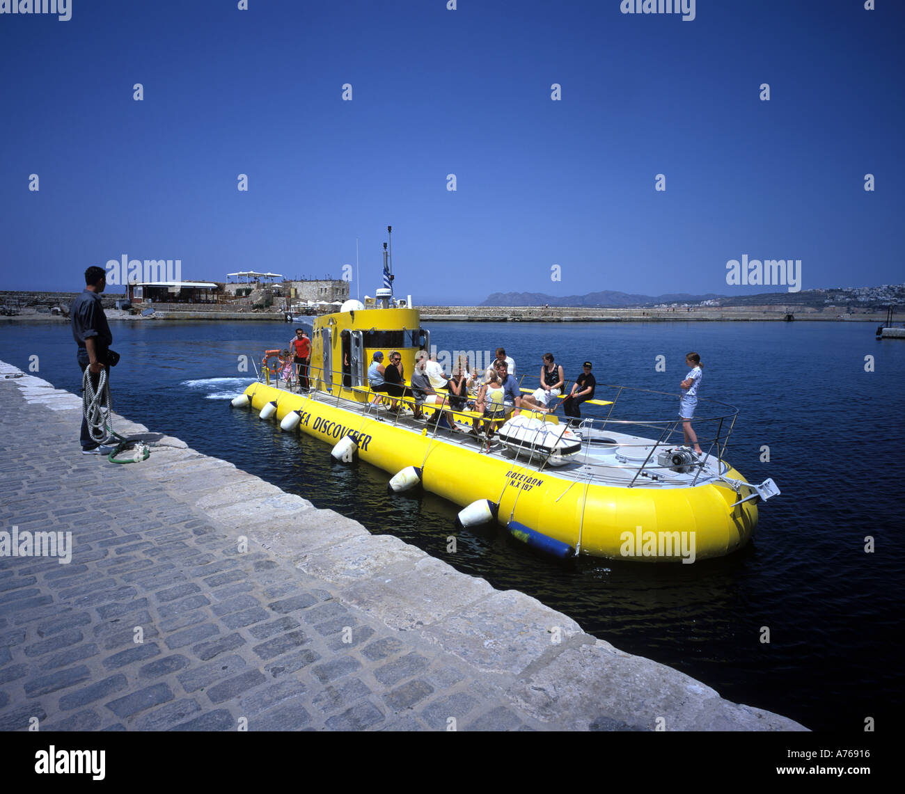 Chania Harbour in Crete. Tourist on a glass bottom boat in Chania Harbour  in Crete Stock Photo - Alamy