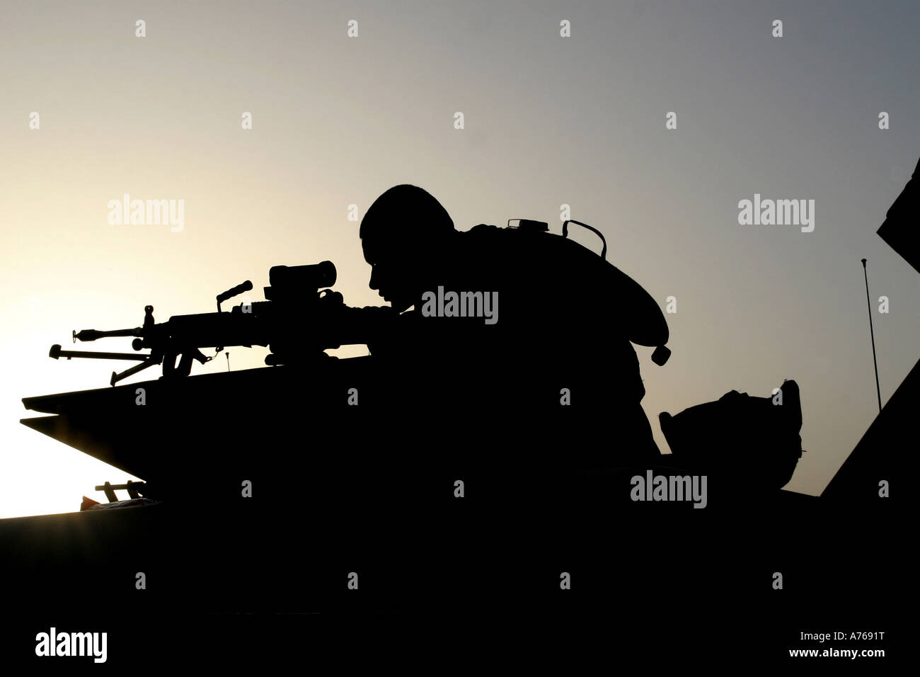 Squad Automatic Weapon (SAW) gunner, looks through the sights of his