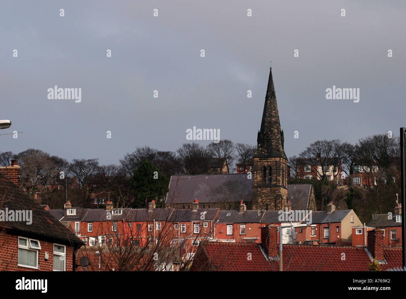 Worsbrough St Thomas Church visible above houses Stock Photo Alamy
