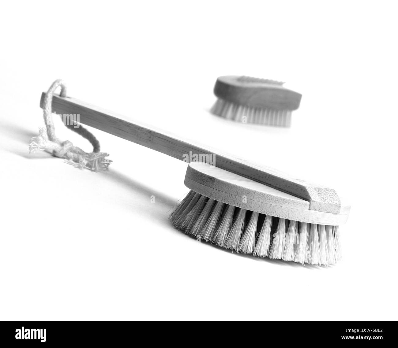 LANDSCAPE IMAGE OF TWO BRUSHES USED IN HEALTH AND BEAUTY TREATMENTS Stock Photo