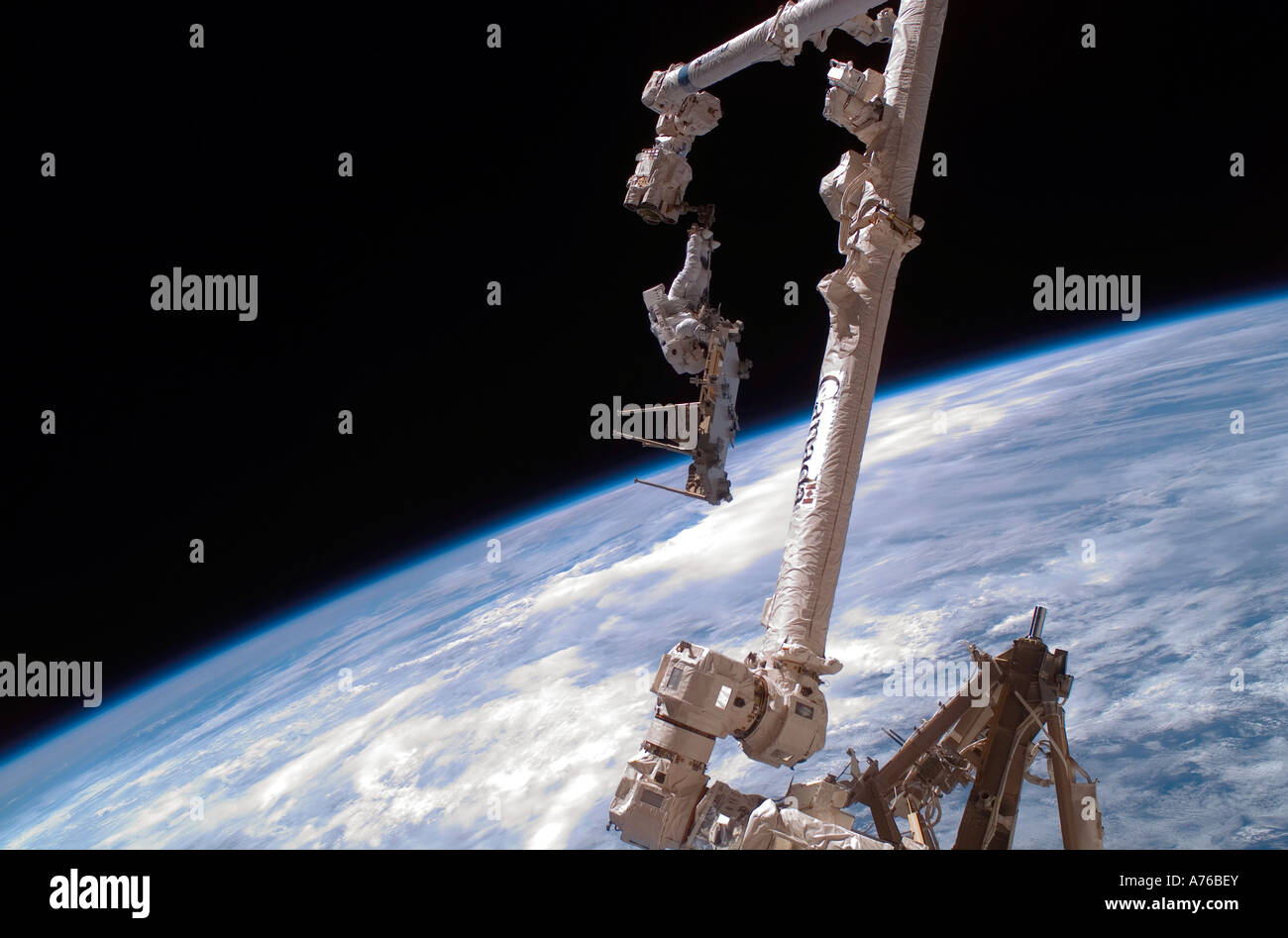 December 14, 2006 - An astronaut anchored to the International Space Station's Canadarm2 foot restraint. Stock Photo