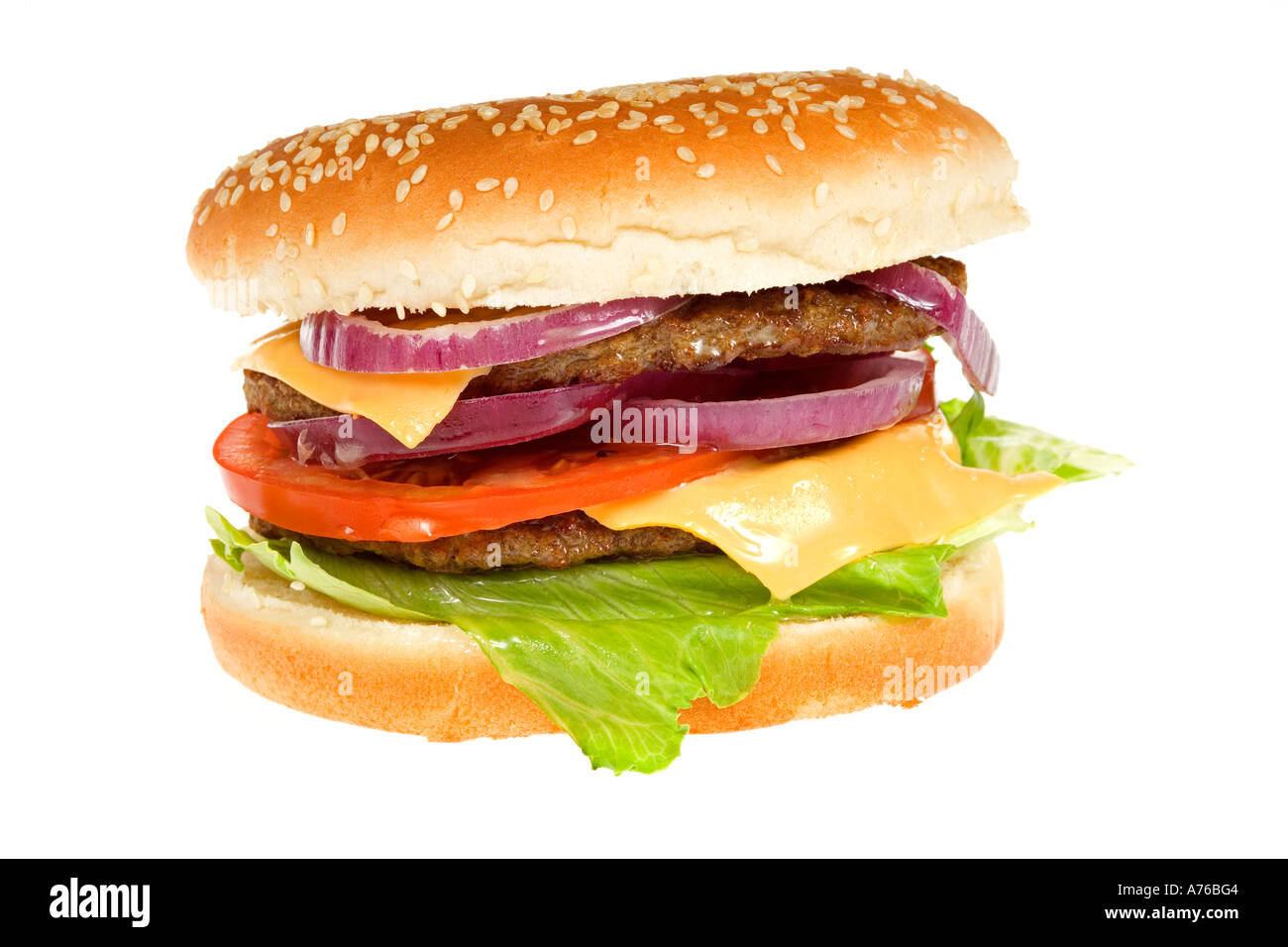 Double Beefburger with cheese and salad in a sesame seed bun on a pure white background. Stock Photo