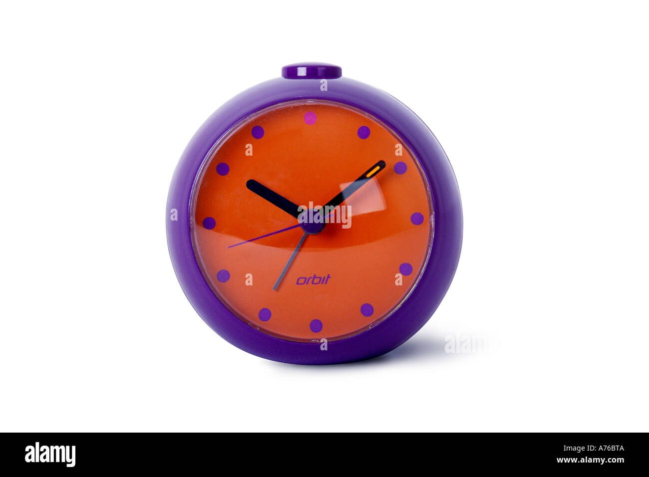Colourful purple and red orange alarm clock on a pure white background. Stock Photo