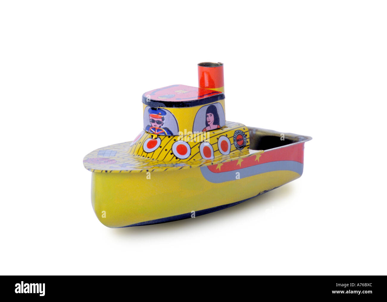 Child's toy tin boat on a pure white background. Stock Photo