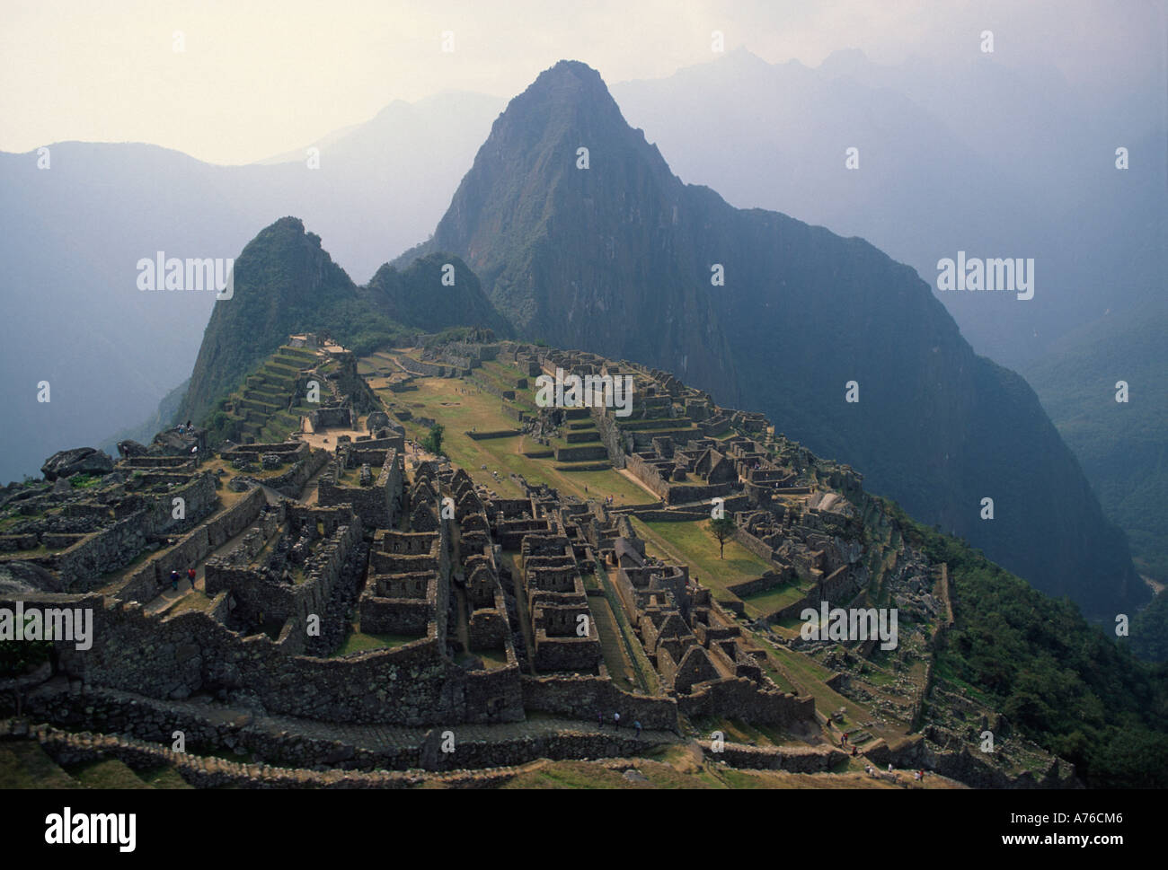 Machu Picchu with Huaynu Picchu in early morning light, stunning view. Stock Photo