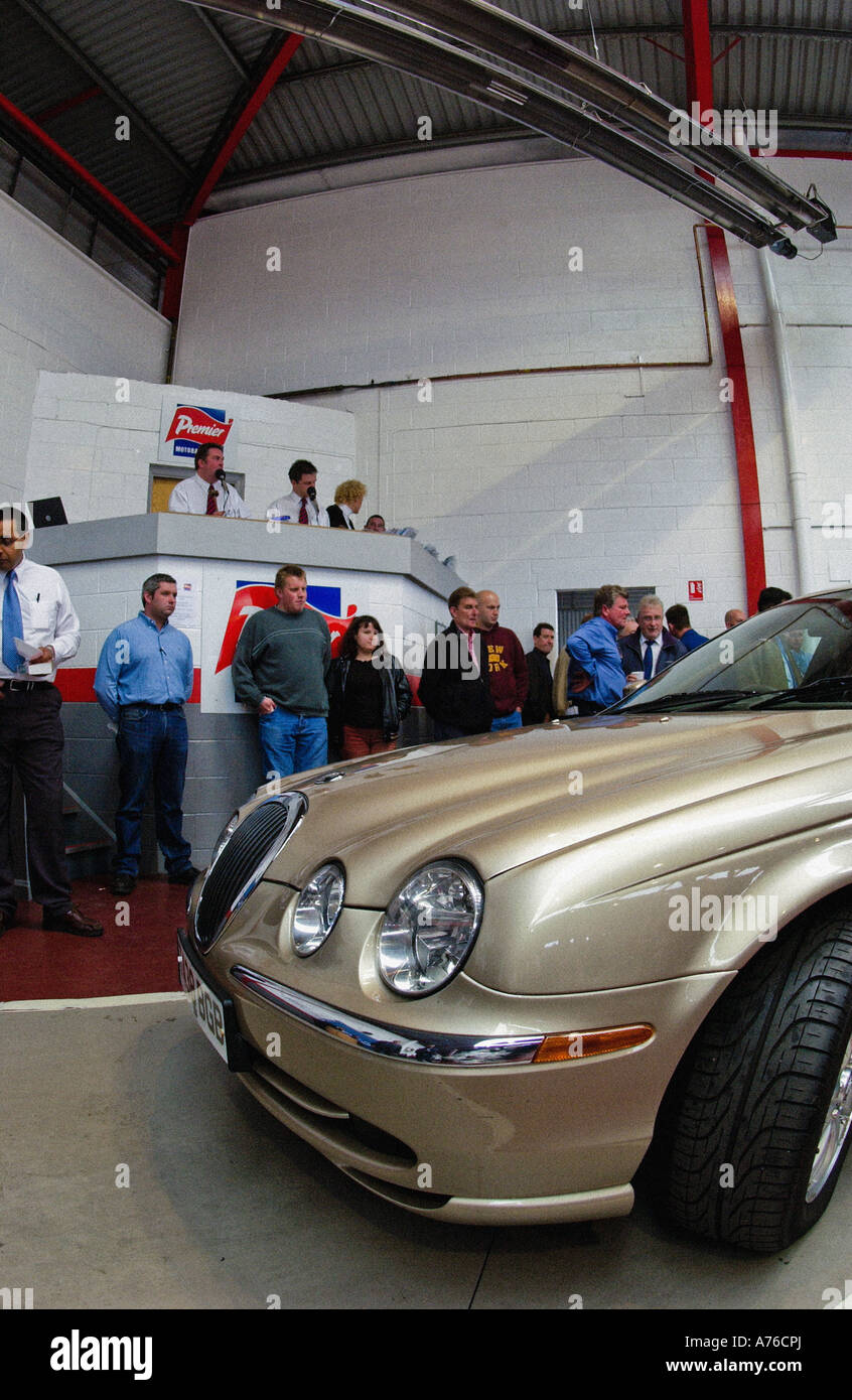 Champagne coloured Jaguar SType car being sold at a car auction, UK
