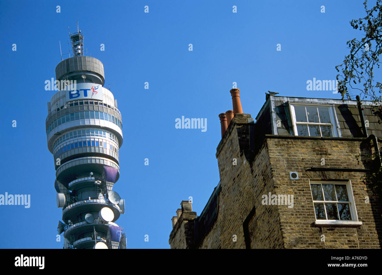 Close up compressed perspective view of the BT Post Office Tower from ground level against a blue sky. Stock Photo