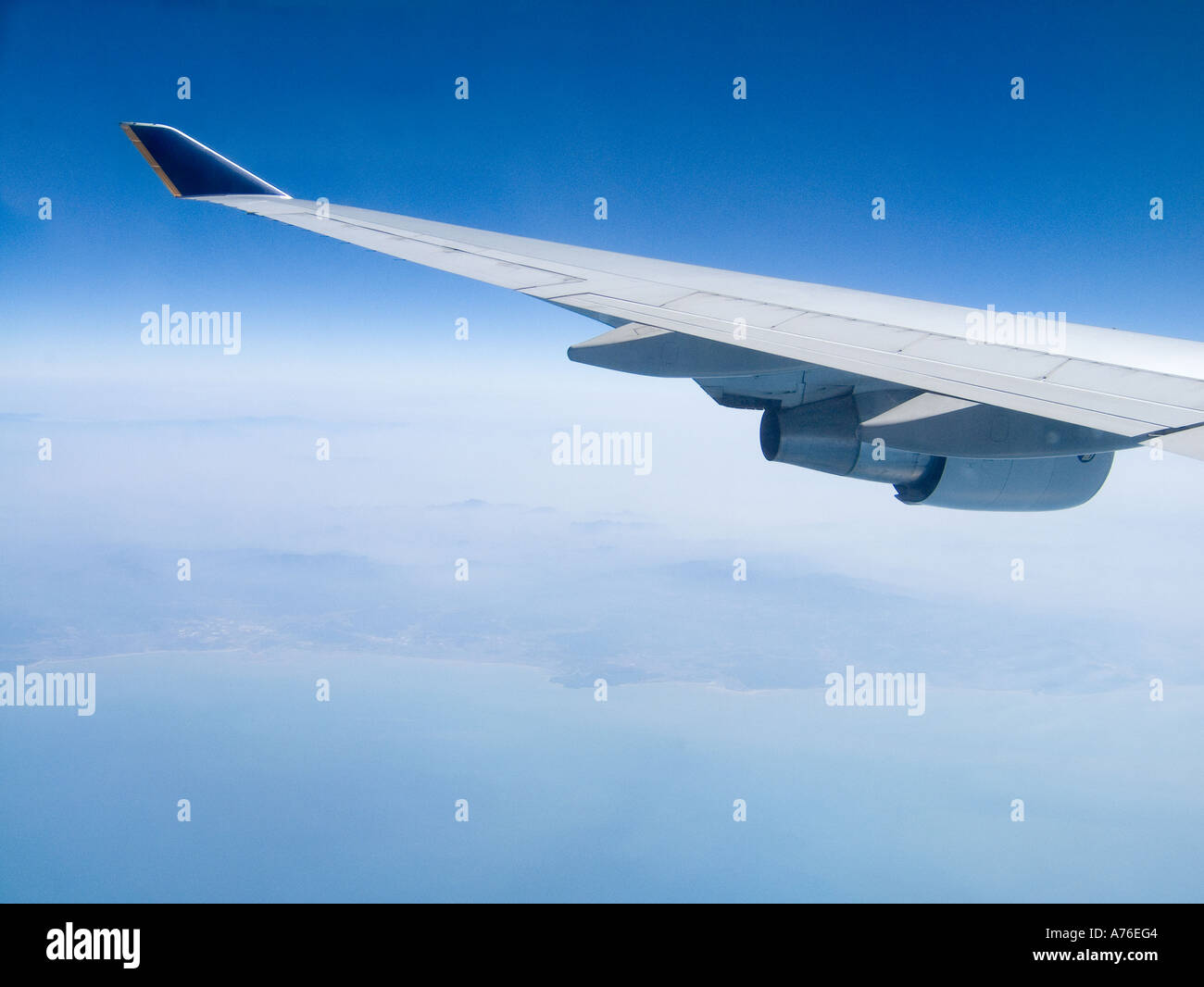 Aircraft wing during high level flight Stock Photo - Alamy