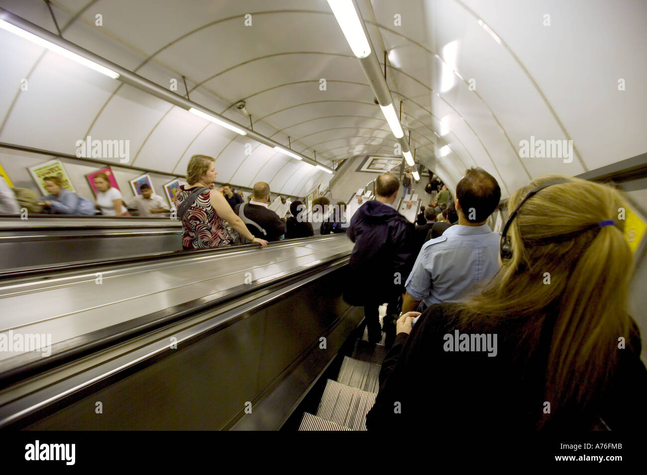 Commuters travelling up and down the escalators at an underground station Stock Photo Alamy
