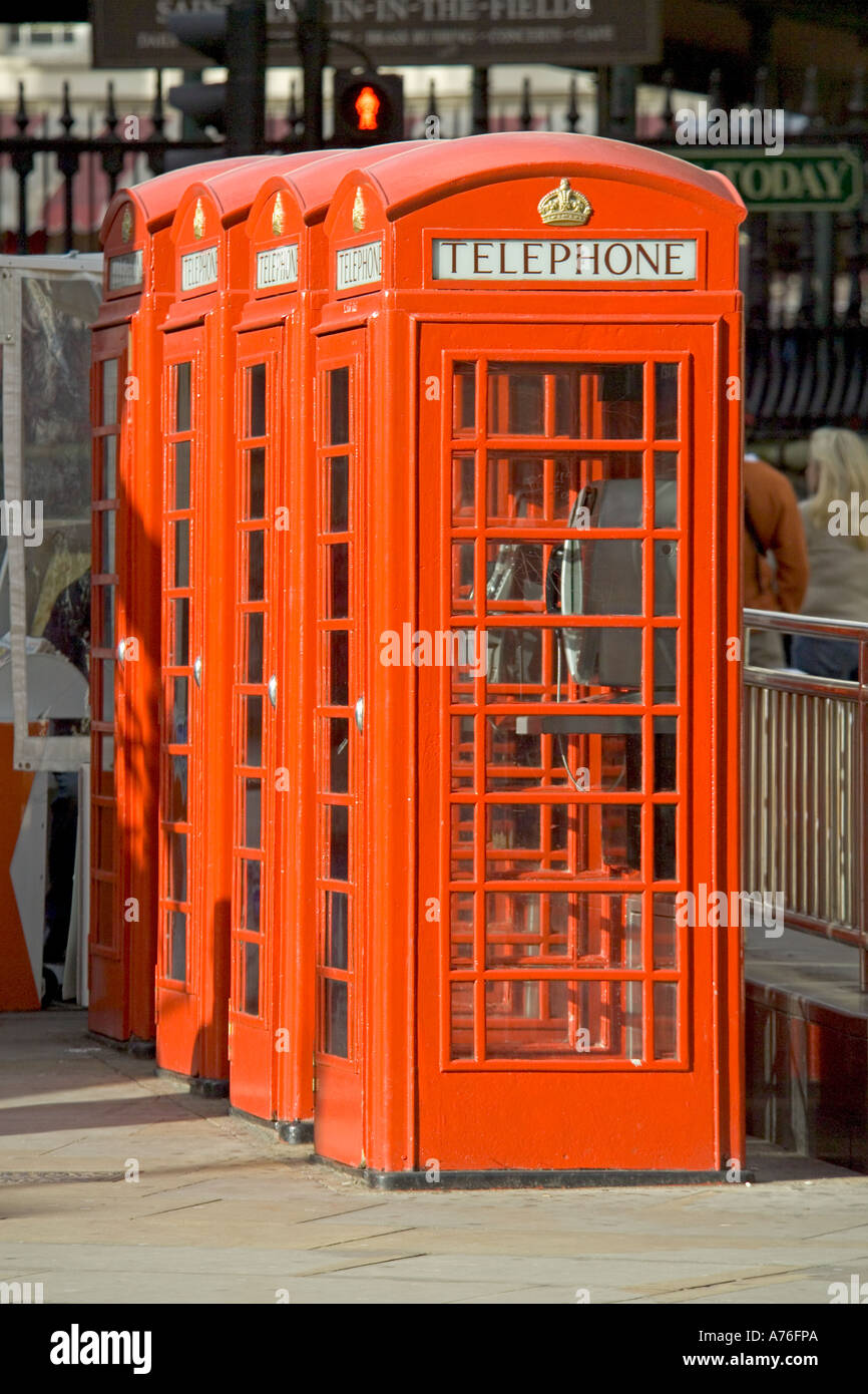 A row of traditional bright red telephone boxes Stock Photo Alamy