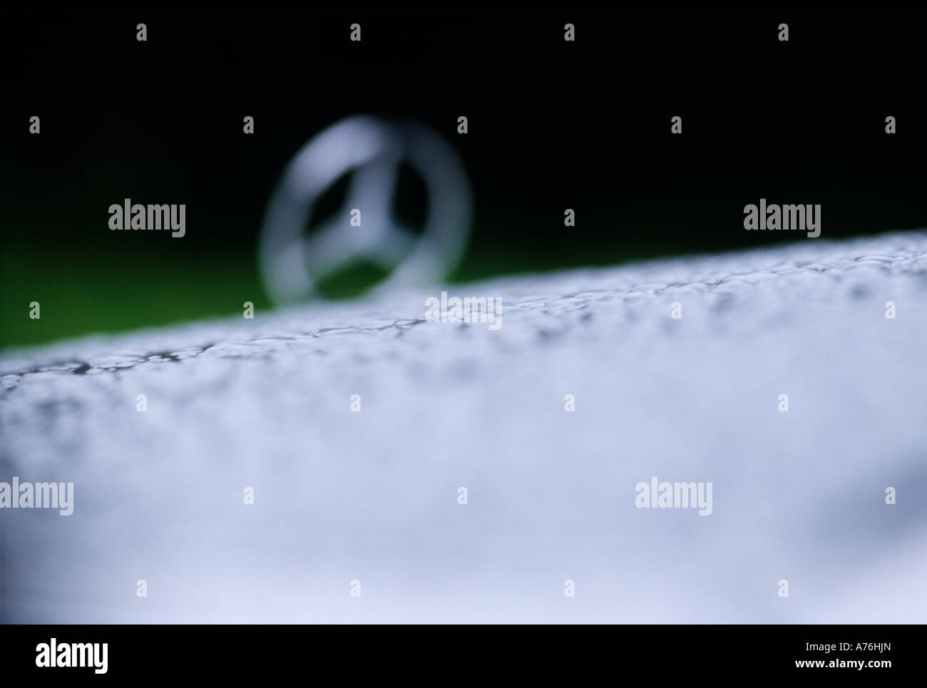 Mercedes CLK AMG 55 badge with raindrops over the bonnet Stock Photo