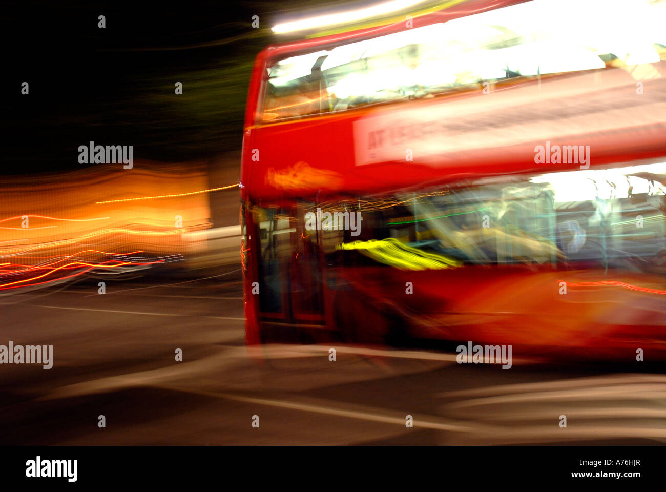 Red double decker bus at night blur image London Stock Photo