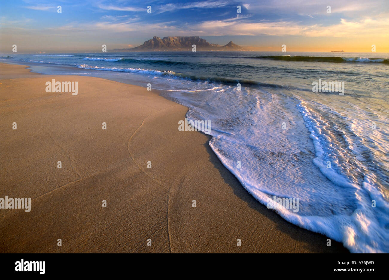 Sunset at Bloubergstrand beach with Table Mountain on the horizon. Stock Photo