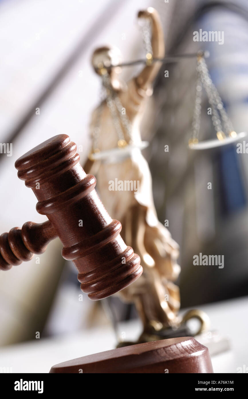 Justitia figurine behind gavel, tilt view Stock Photo