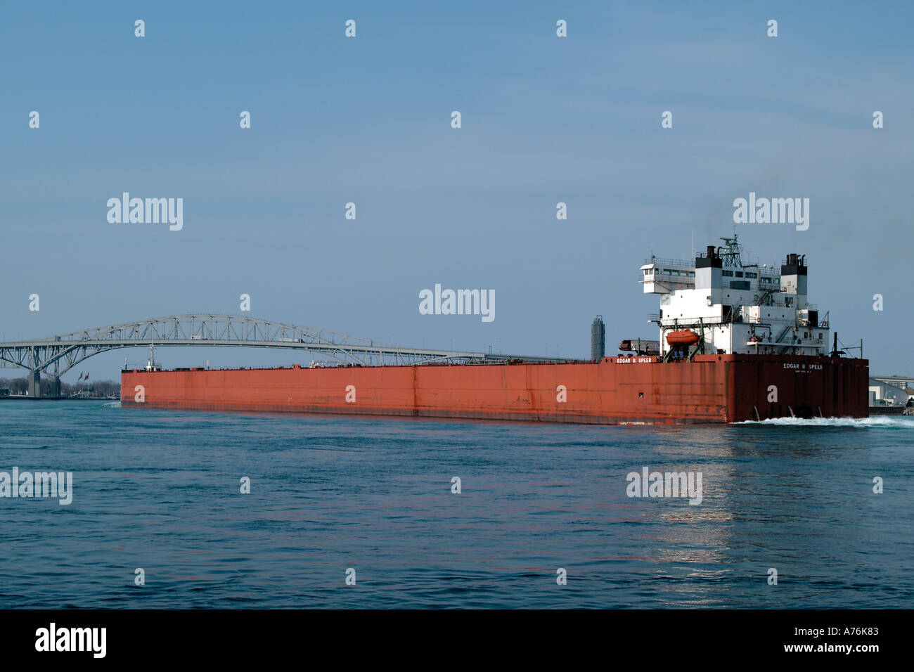 Freighter Edgar B Speers heads up the St Clair River out into Lake Huron of the shore of Port Huron MI Stock Photo