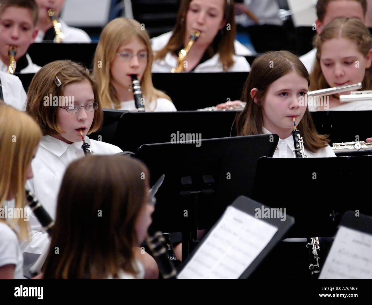 Two student oboists in concert performance surrounded by fellow band members Stock Photo