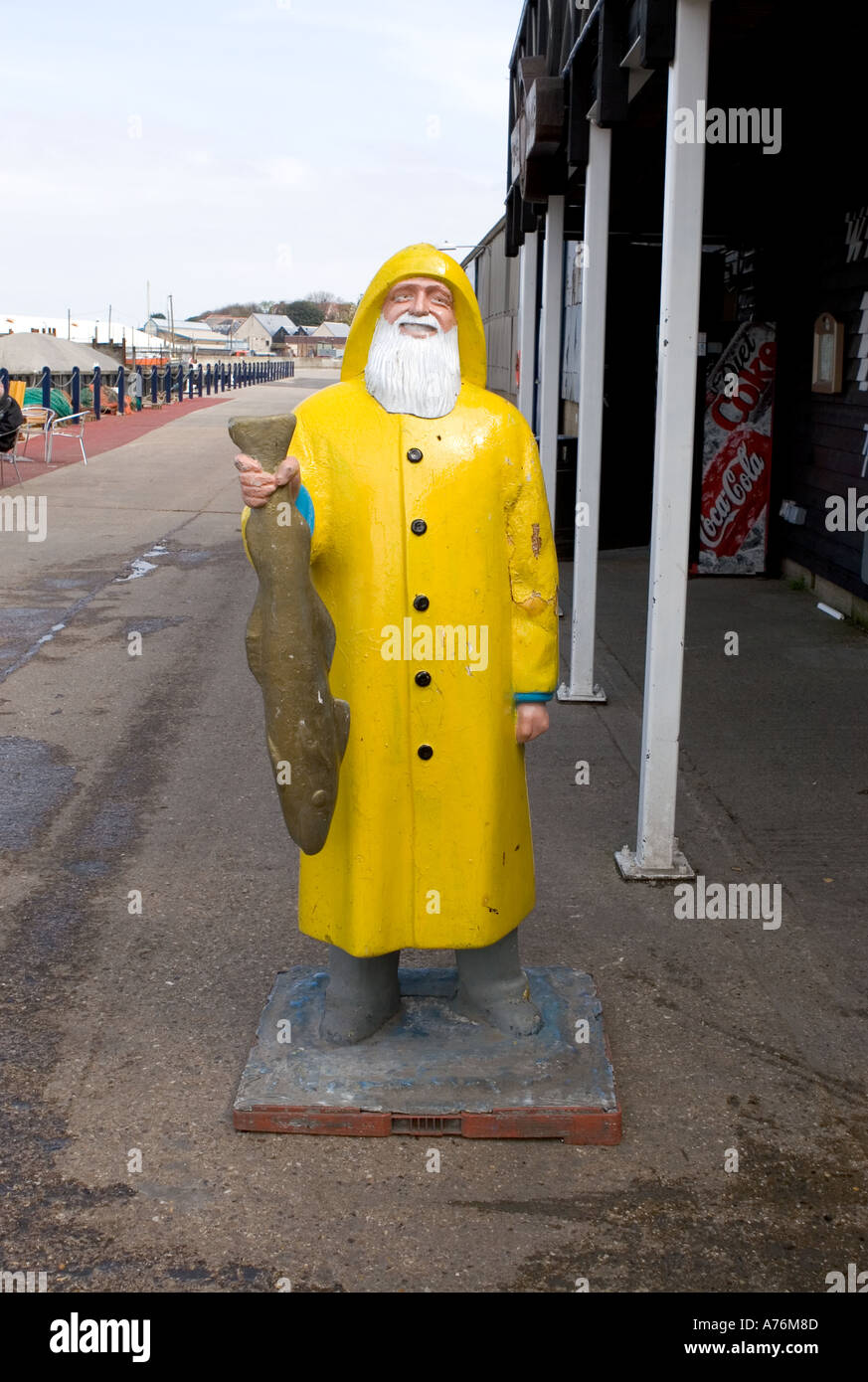 A fibreglass model of a bearded fisherman outside Whitstable Fish Market in Kent UK Stock Photo