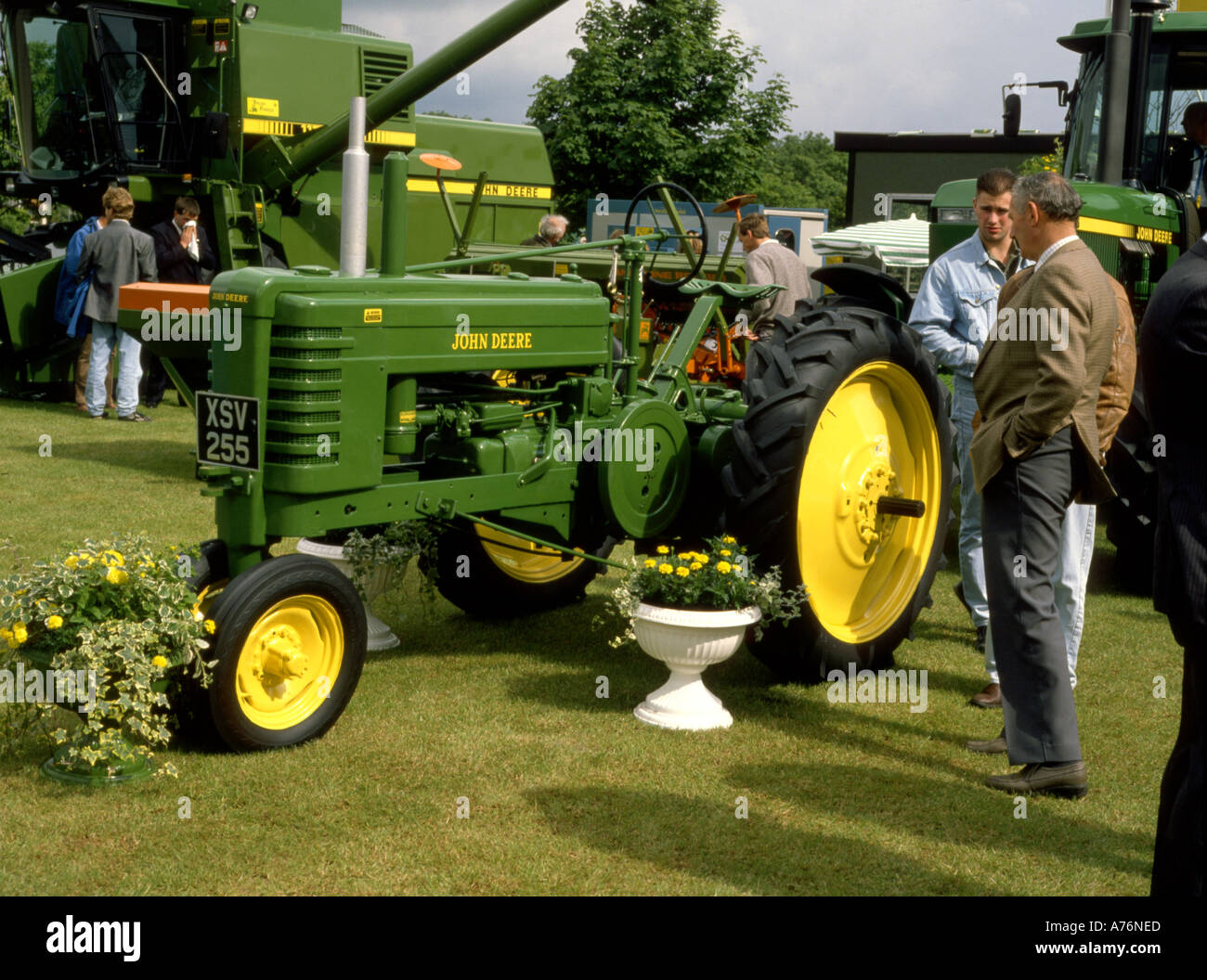 Vintage John Deere tractor on display at agricultural show in