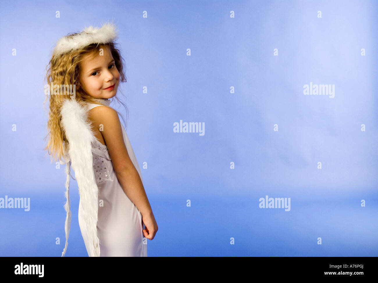 Girl dressed as angel, portrait Stock Photo - Alamy