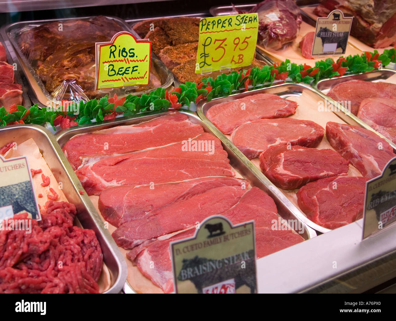 Meat on butcher stall on sale in the indoor market Newport Wales UK