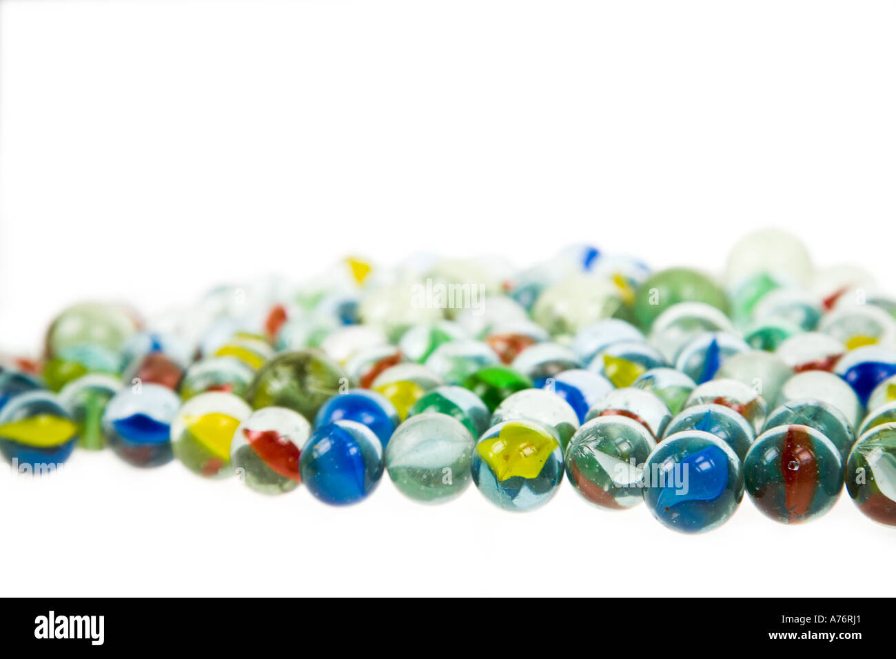 Traditional coloured glass marbles on white background Stock Photo - Alamy