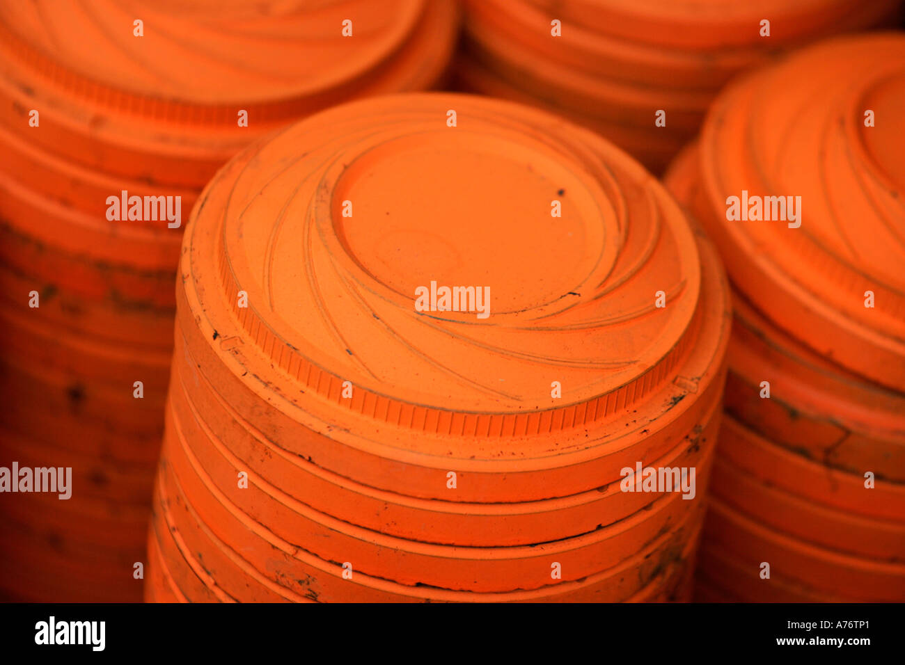 close up of stack of orange neon clay pigeons on december shooting